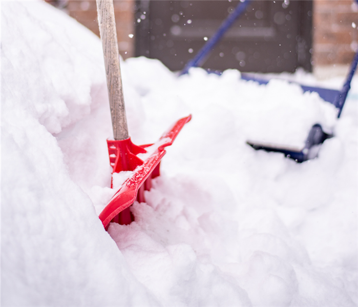 snow and a snow shovel